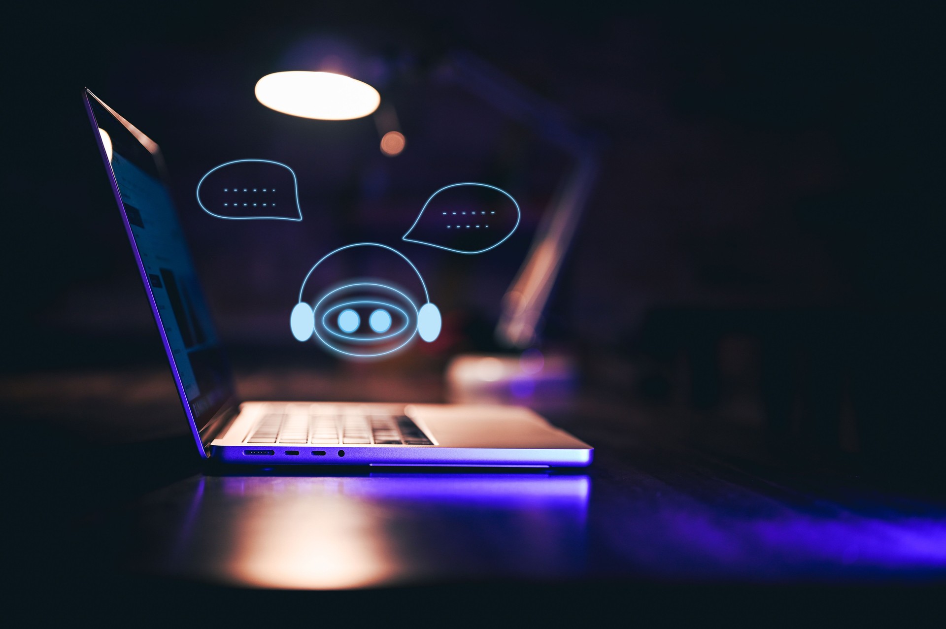 Chatbot providing online customer service on a laptop at night